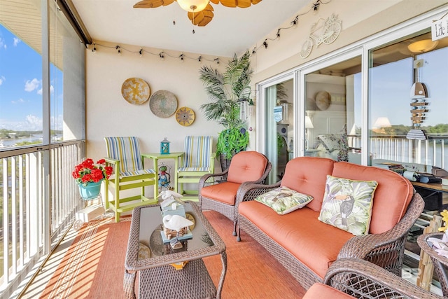 sunroom featuring ceiling fan
