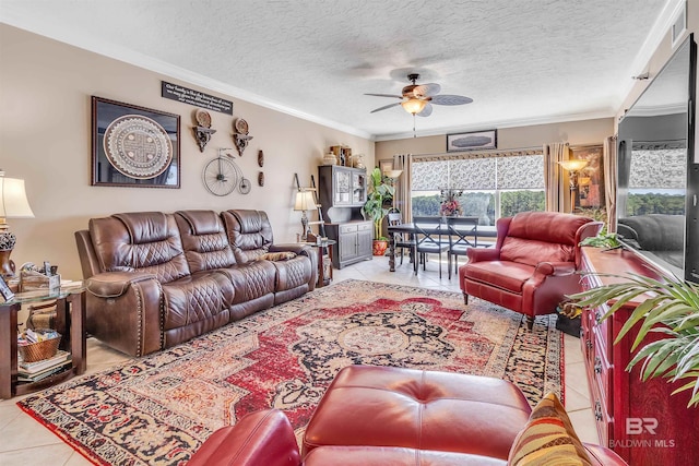 tiled living area with crown molding, a ceiling fan, and a textured ceiling