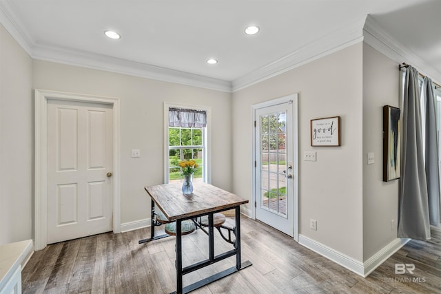 office with wood-type flooring and ornamental molding