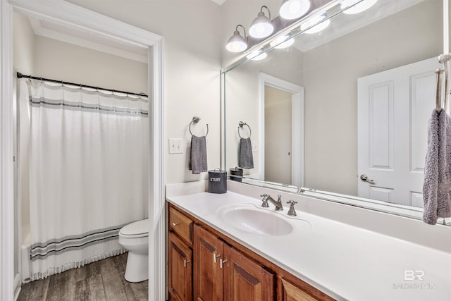 full bathroom featuring vanity, toilet, shower / tub combo with curtain, and hardwood / wood-style floors