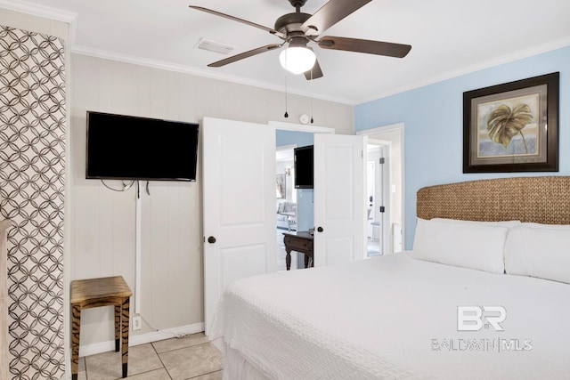 tiled bedroom featuring ceiling fan and crown molding