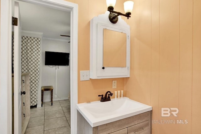 bathroom featuring vanity, crown molding, and tile patterned floors