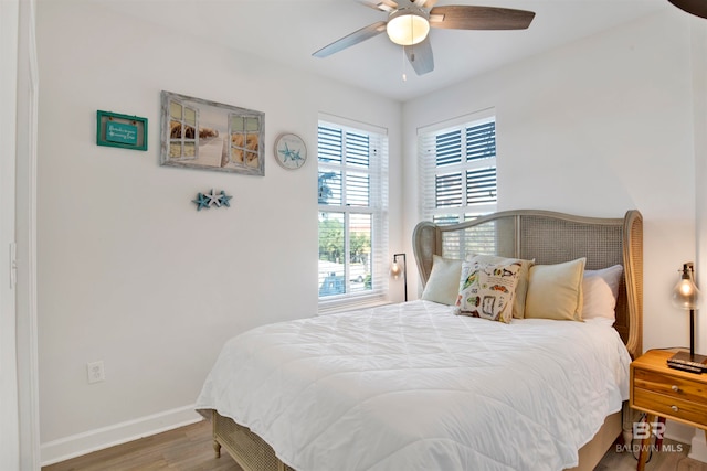 bedroom featuring hardwood / wood-style flooring and ceiling fan