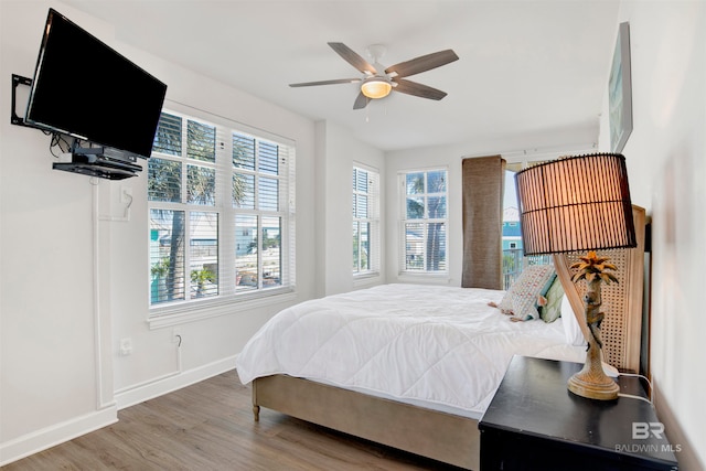 bedroom featuring hardwood / wood-style floors and ceiling fan