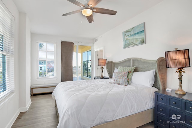 bedroom with light wood-type flooring and ceiling fan