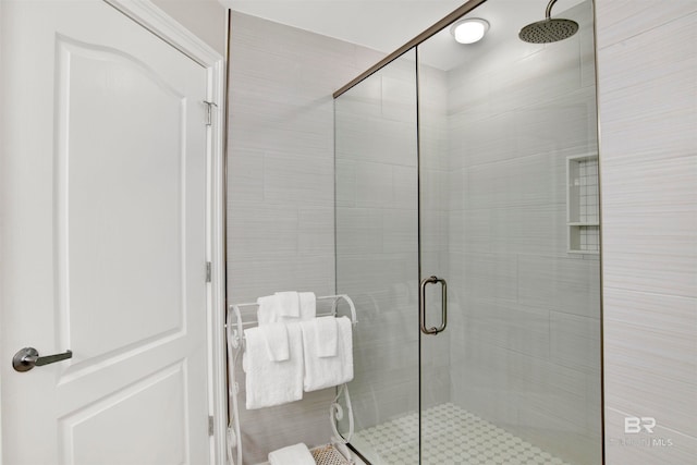 bathroom featuring an enclosed shower