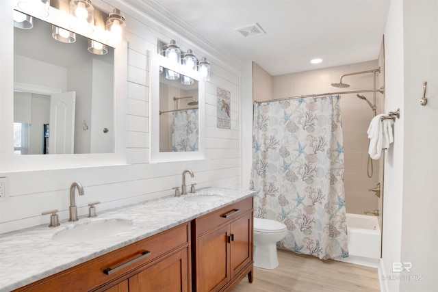 full bathroom with vanity, toilet, shower / tub combo, and hardwood / wood-style floors