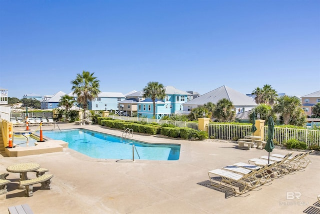 453 Dune Dr Unit 101, Gulf Shores, AL 36542 - pool with fence, a patio area, and a residential view