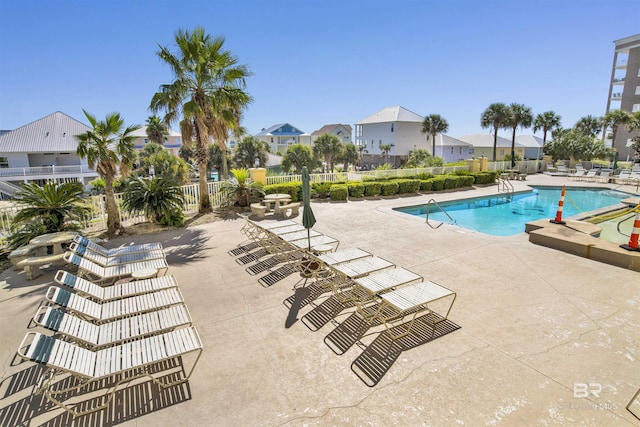 453 Dune Dr Unit 101, Gulf Shores, AL 36542 - pool with fence, a patio area, and a residential view