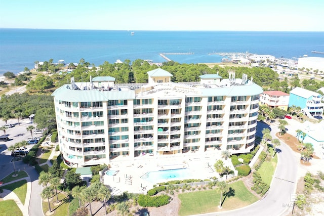 birds eye view of property with a water view