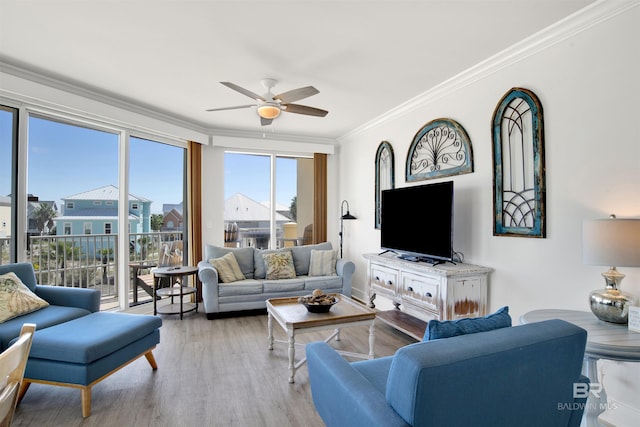 453 Dune Dr Unit 101, Gulf Shores, AL 36542 - living area with a ceiling fan, ornamental molding, and wood finished floors