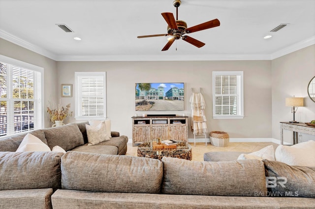 tiled living area featuring a ceiling fan, visible vents, ornamental molding, and baseboards