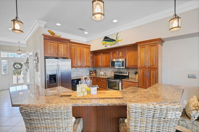 kitchen with light tile patterned floors, visible vents, appliances with stainless steel finishes, backsplash, and brown cabinets