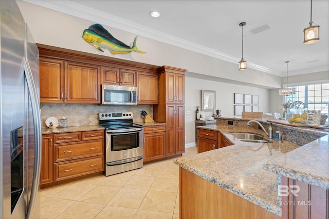 kitchen featuring appliances with stainless steel finishes, brown cabinets, and a sink