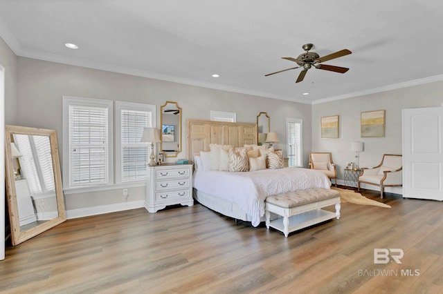 bedroom with recessed lighting, wood finished floors, a ceiling fan, baseboards, and ornamental molding