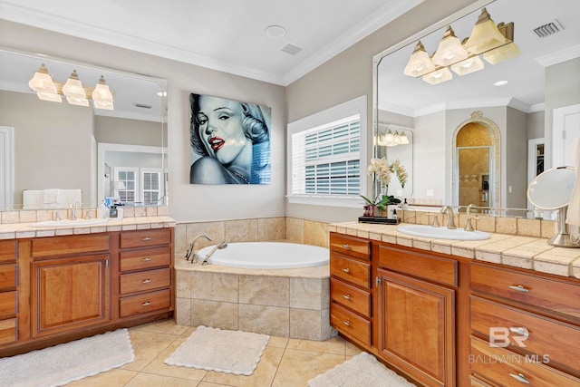 bathroom featuring crown molding, tile patterned flooring, and a sink