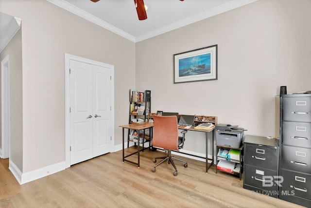 office space featuring ceiling fan, crown molding, baseboards, and wood finished floors