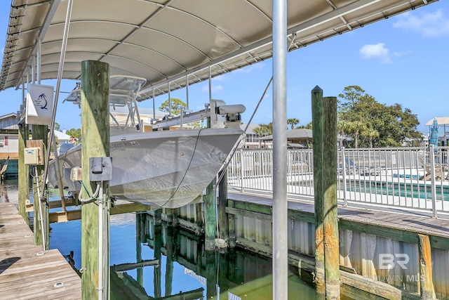 dock area featuring a water view and boat lift