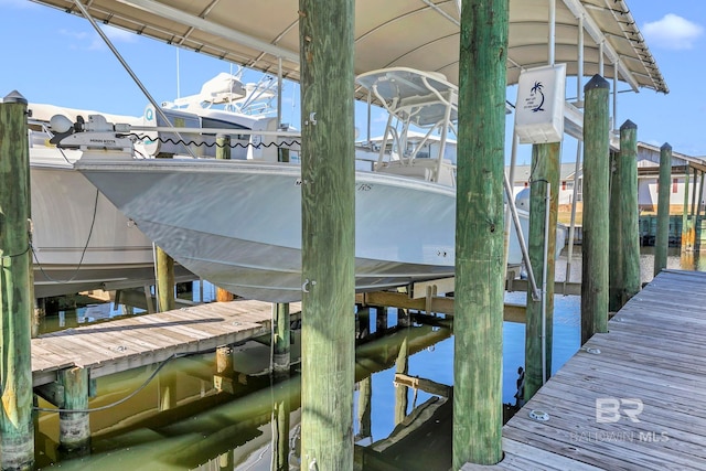 view of dock featuring a water view and boat lift