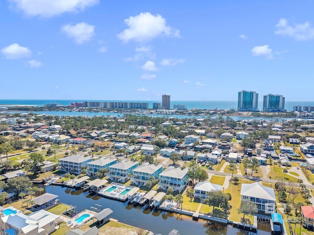 drone / aerial view featuring a water view and a city view