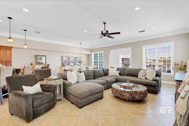 living area with light tile patterned floors, plenty of natural light, and visible vents