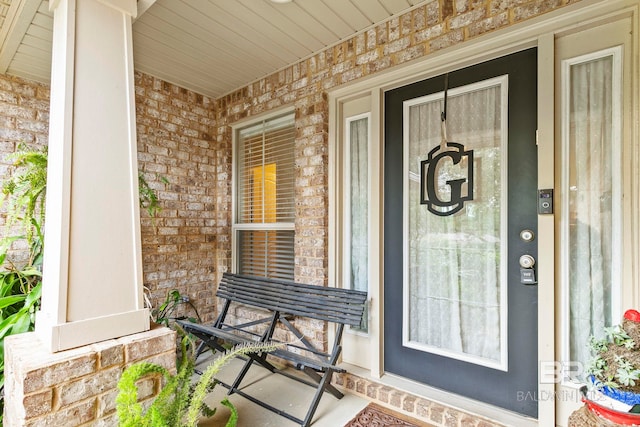 property entrance with covered porch