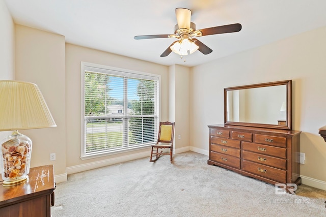 sitting room with light carpet and ceiling fan