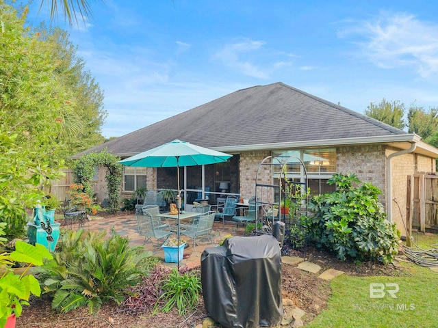 rear view of property featuring a patio