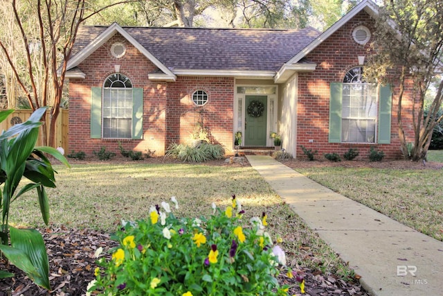 ranch-style home with a front yard