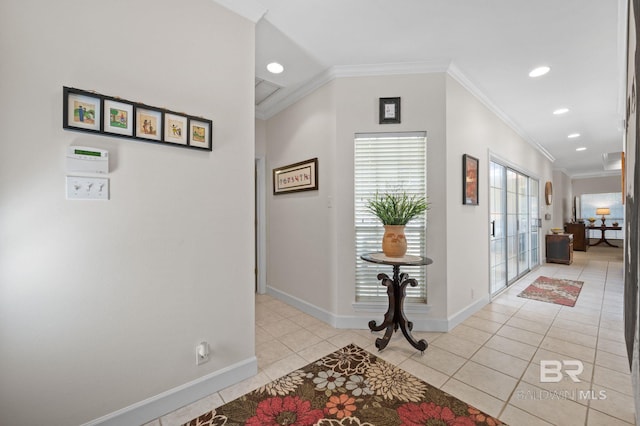 hallway featuring ornamental molding and light tile patterned flooring