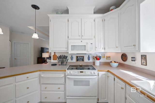 kitchen featuring crown molding, pendant lighting, white cabinets, and white appliances