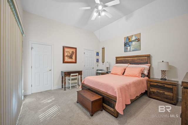 carpeted bedroom with ceiling fan and lofted ceiling