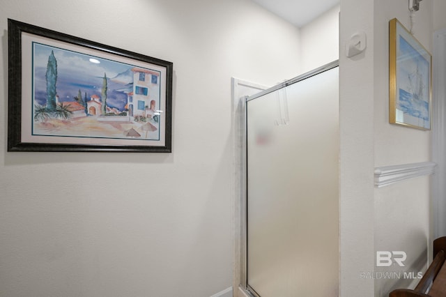 bathroom with a shower with shower door