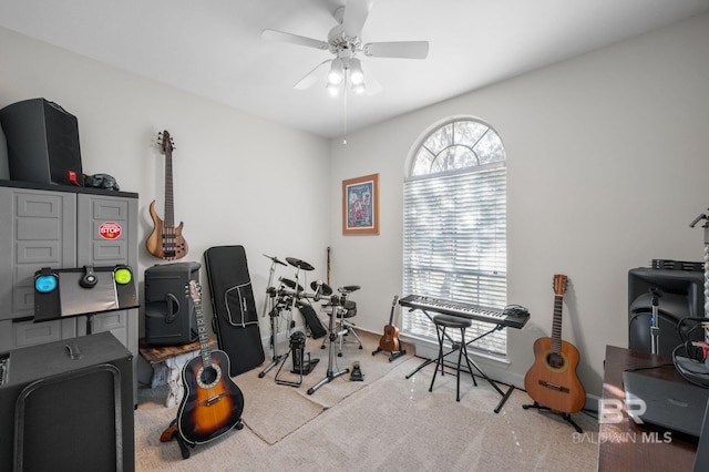 interior space with light colored carpet and ceiling fan