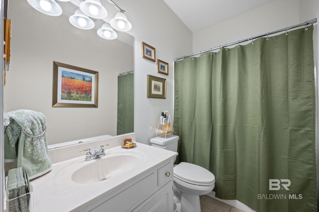 bathroom featuring walk in shower, tile patterned floors, vanity, and toilet