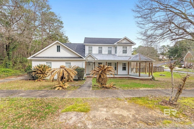 view of front of house with a front lawn and a porch