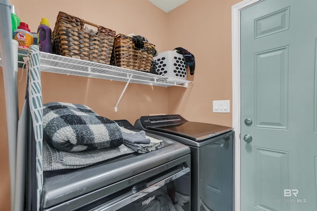 laundry room featuring washing machine and clothes dryer