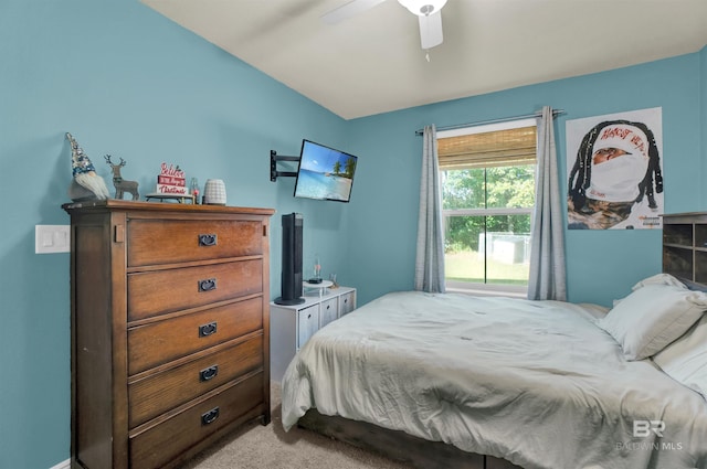 bedroom with ceiling fan and light colored carpet