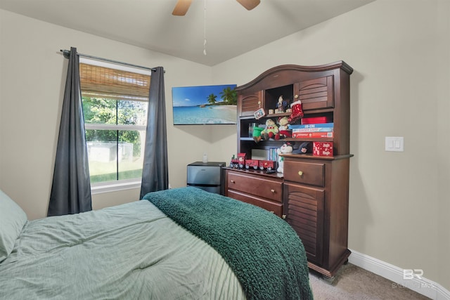 bedroom featuring ceiling fan and light carpet