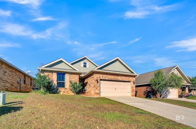 view of front of home with a front yard and a garage