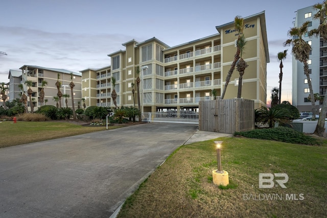 view of outdoor building at dusk