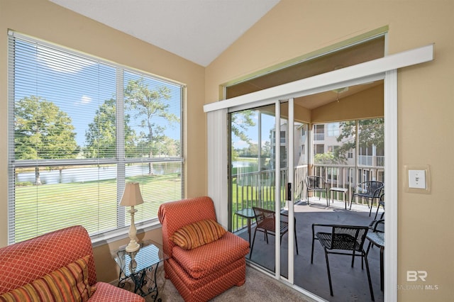 sunroom featuring a wealth of natural light and vaulted ceiling