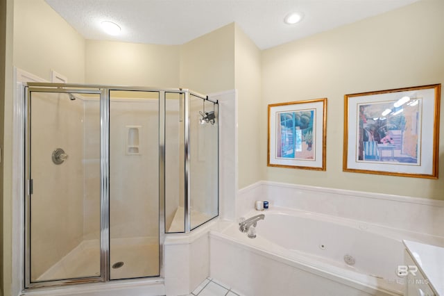 bathroom with shower with separate bathtub, a textured ceiling, tile patterned floors, and vanity