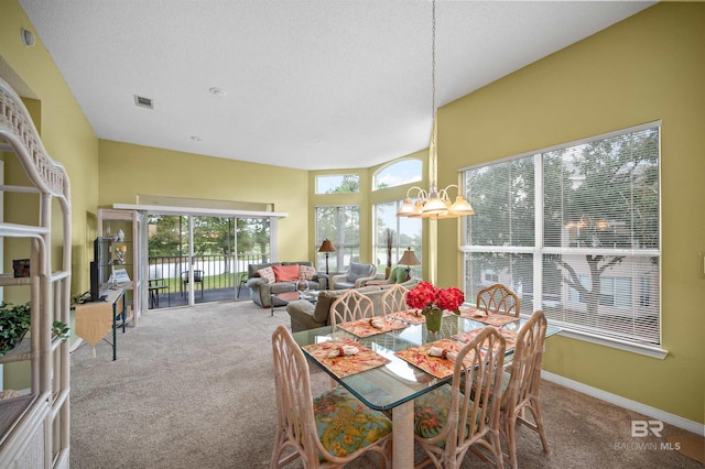 sunroom featuring an inviting chandelier