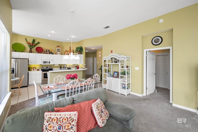 carpeted dining space featuring sink