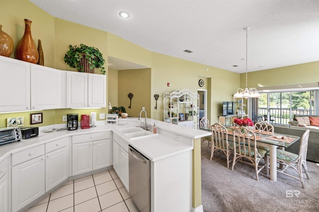 kitchen with dishwasher, kitchen peninsula, light carpet, and sink