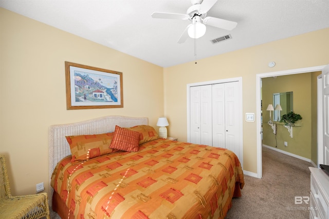 bedroom featuring a closet, light colored carpet, and ceiling fan