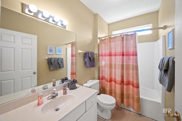 full bathroom featuring vanity, toilet, a textured ceiling, and shower / tub combo