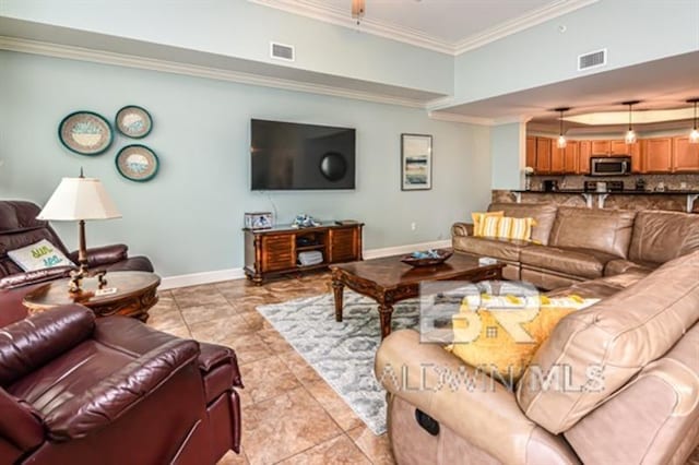 living room with ornamental molding