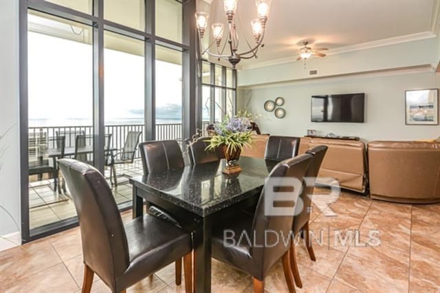 dining room featuring ornamental molding, ceiling fan with notable chandelier, and light tile patterned floors